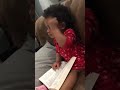 a child reading a scarms