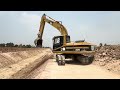 Excavator SUMITOMO AND dump trucks Clear Land grab on the canals