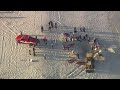 Sand collapses onto teens digging hole at beach at Jersey Shore