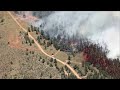 RAW: Helicopter video appears to show wildfire burning home, vehicles north of Lyons