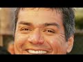 George Lopez smiles at you while an emergency broadcast plays