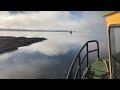 Log raft into the morning mist on lake Saimaa