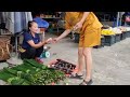 Looking for dong leaves and sugar cane in the forest to sell at traditional markets