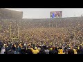 Michigan fans storm the field & sing Mr Brightside after beating Ohio State