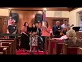 The Harris Family and Friends perform and sing 