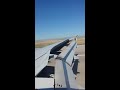 Frontier Airlines landing at Denver International Airport