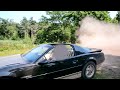 TransAm 5.7 V8 doing donuts on gravel