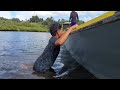 adventurous camping using a boat in heavy rain