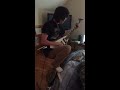 My brother practicing guitar